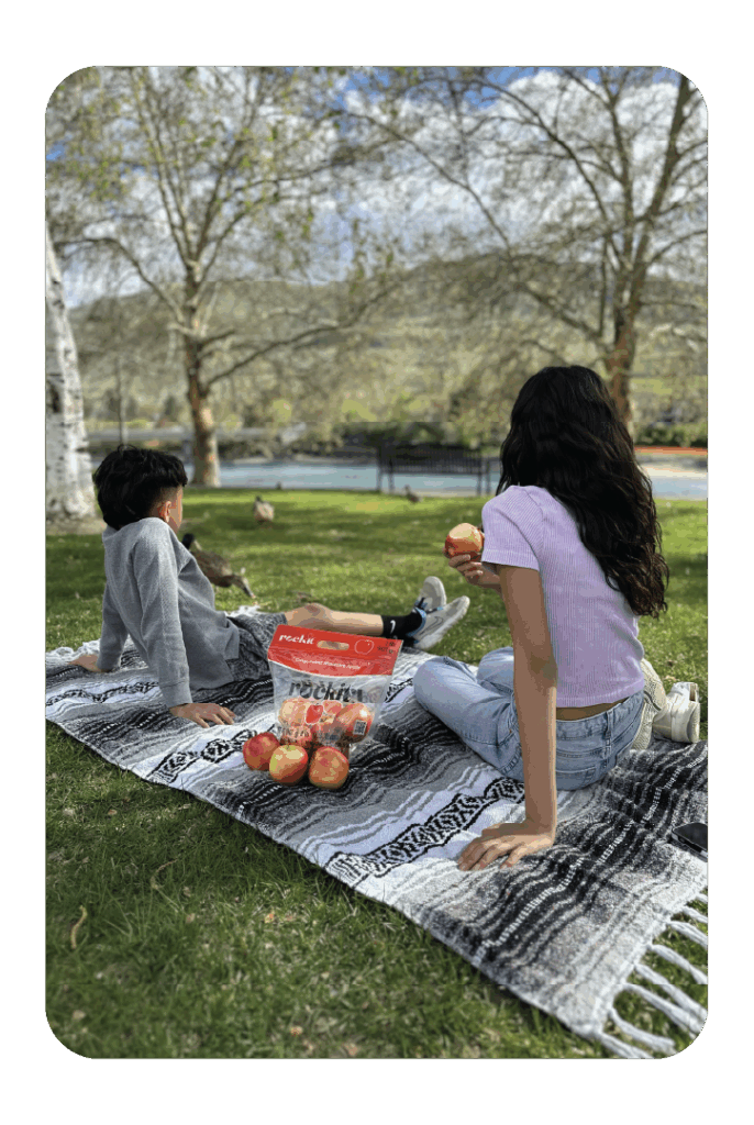 kids with rockit apples at park